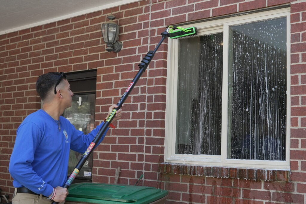 Texas Window Washing crew washing commercial glass at a San Antonio business